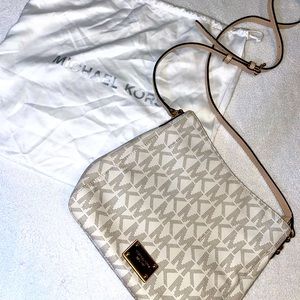 Michael Kors cross body bag! …the duster has seen more action than the purse